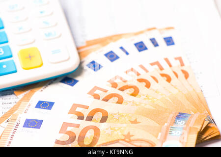 Calculator and euro money on a table desk Stock Photo