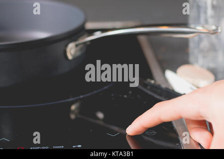 Cook Is Switching On The Induction Cooktops Stock Photo 169867238