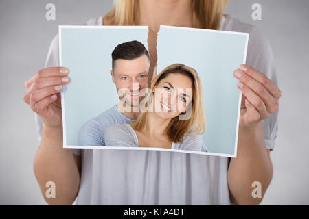 Woman Tearing Photo Stock Photo