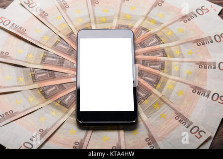 Mobile Phone On Euro Note Stock Photo