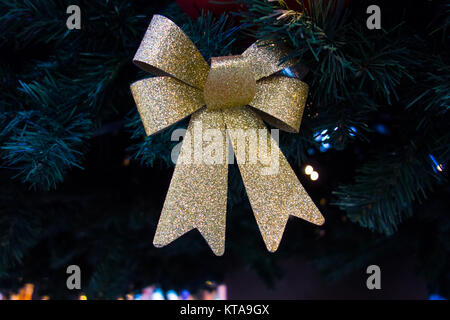 Golden ribbon on Christmas tree Stock Photo