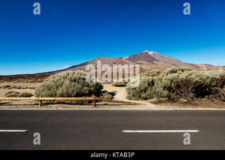 Stretch of road going through Teide National Park, Tenerife, leading to Montana Blanca. The landscape throughout this park is very rich and colourful. Stock Photo
