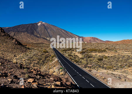 Stretch of road going through Teide National Park, Tenerife, leading to Montana Blanca. The landscape throughout this park is very rich and colourful. Stock Photo
