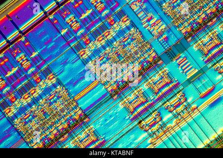 Light micrograph of a detail of a RAM computer memory chip. RAM is a type of computer memory that can be accessed randomly; that is, any byte of memory can be accessed without touching the preceding bytes.This is the most common type of memory found in personal computers and different other electronic devices like cellular phones, usb sticks and printers. Objcet size of this section approx. 1.2 mm across.