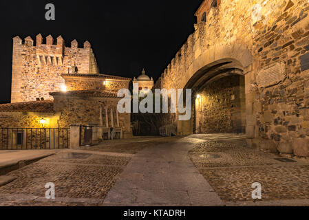 Cobblestone Road leads into the Ciudad Monumental, Caceres, Spain with Tower Bujaco on Left Stock Photo