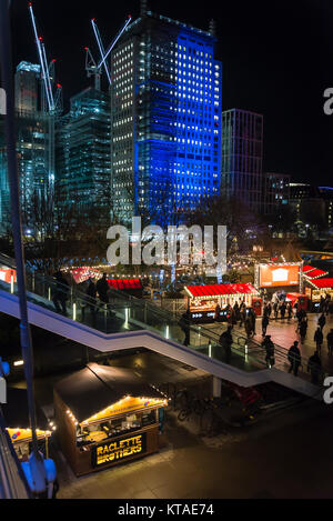 Christmas market at the Southbank and Construction site near Waterloo station in the background at night, London, England, UK Stock Photo