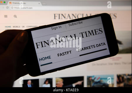 The Financial Times website on a phone and a website Stock Photo