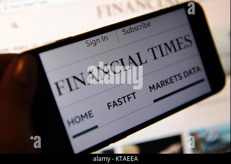 The Financial Times website on a phone and a website Stock Photo
