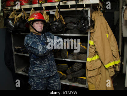 PORTLAND, Ore. (Dec 13, 2017) – Engineman 3rd class Brittany Randall, from Louisville, Ky., assigned to the submarine tender USS Frank Cable (AS 40), poses for a Stock Photo