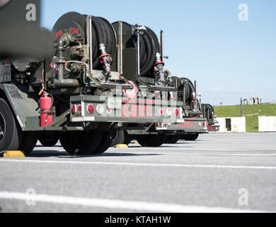 Refueling trucks sit parked, Dec. 21, 2017, at Kadena Air Base, Japan.  The refueling maintenance shop is an outlying vehicle maintenance shop of the 18th Wing Logistics Readiness Squadron at Kadena AB that specializes in maintaining and repairing refuel trucks. (U.S. Air Force Stock Photo