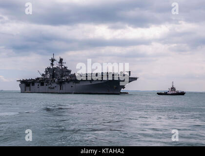 Singapore (Dec. 22, 2017) - The amphibious assault ship USS America (LHA 6) pulls in to RSS Singapura - Changi Naval Base, Singapore during a regularly scheduled port visit Dec. 22. America, part of the America Amphibious Ready Group, with embarked 15th Marine Expeditionary Unit, is operating in the Indo-Asia Pacific region to strengthen partnerships and serve as a ready-response force for any type of contingency. (U.S. Navy Stock Photo