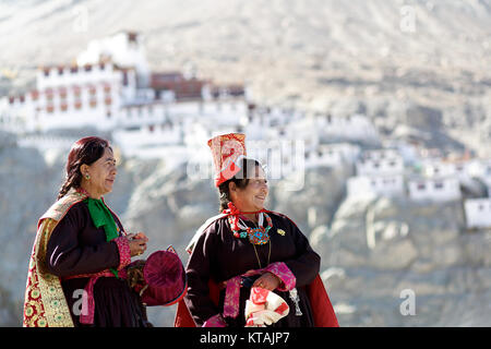 Two women in traditional costumes and headwear at annual festival at diskit Monastery, Nubra valley, Ladakh, Jammu and Kashmir, India. Stock Photo