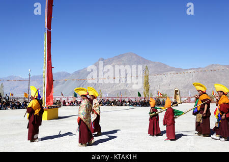 Buddhist monks performs masked dance at religious ceremony, Diskit Monastery, Nubra Valley, Ladakh, Jammu and Kashmir, India. Stock Photo