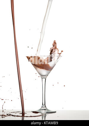 macro shoot with hot chocolate falling in glass on white in studio Stock Photo