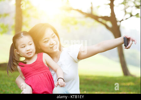 Mother and daughter taking selfie. Stock Photo