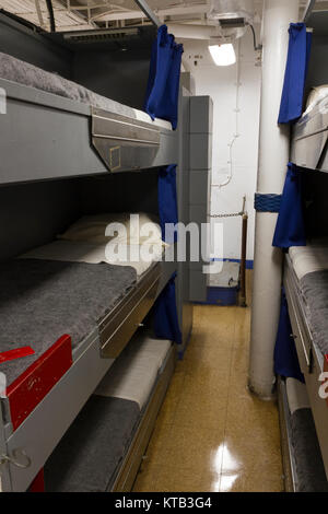 Sleeping bunk on a World War II submarine. The black bags held the ...