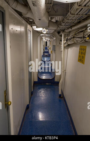 Long corridor on the USS New Jersey Iowa Class Battleship, Delaware River, New Jersey, United States. Stock Photo