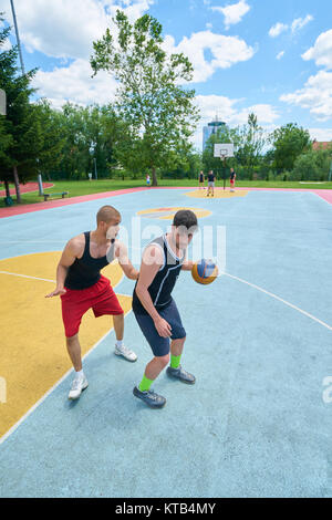 Young boys playing basketball Stock Photo