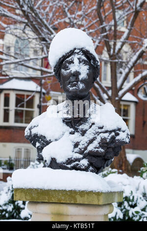 Bronze bust of the novelist Mary Webb covered in snow outside Shrewsbury Library, Shropshire, England, UK Stock Photo