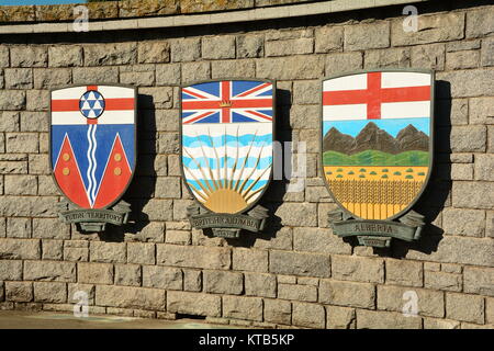 Canadian provincial and Territorial coats of arms hang on a wall in Victoria BC, Canada. Stock Photo