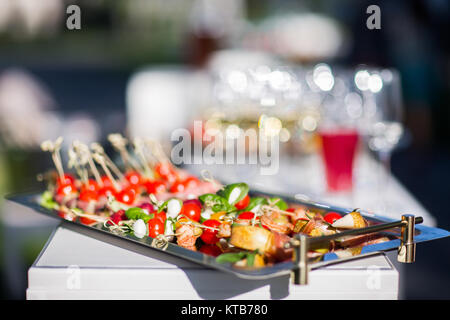Canapes on a silver tray close up. Stock Photo