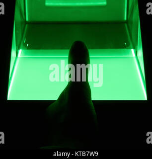 green cybersecurity digital fingerprint scanning on a green screen Stock Photo