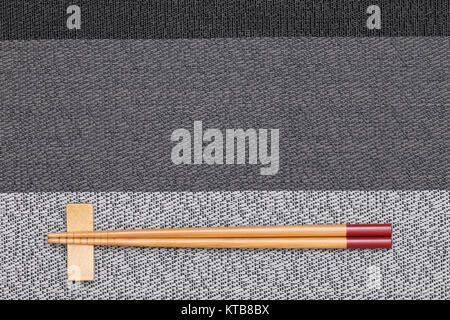 Chopsticks and chopsticks rest on table background Stock Photo