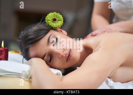Spa woman. Female enjoying relaxing back massage in cosmetology spa centre. Body care, skin care, wellness, wellbeing, beauty treatment concept. Stock Photo