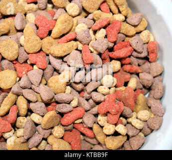 Dried pet kibble in different colors and flavors Stock Photo