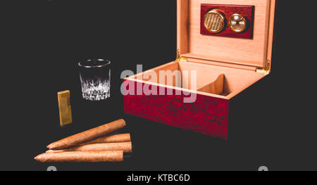 Cigar box on black background and lighter Stock Photo