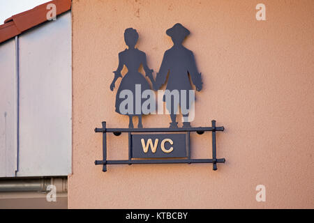signpost toilet with stylized man and woman Stock Photo