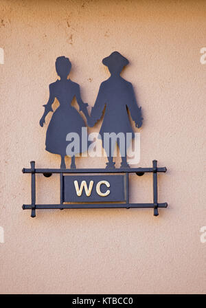 signpost toilet with stylized man and woman Stock Photo