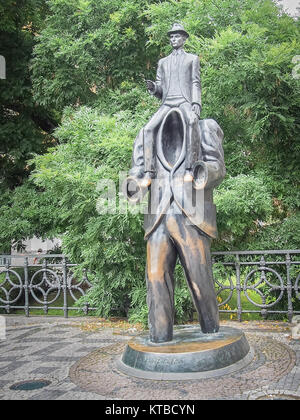 PRAGUE, CZECH REPUBLIC-JULY 23, 2016: Statue of Franz Kafka (A political candidate is held on the shoulders of a giant man) by Jaroslav Róna Stock Photo