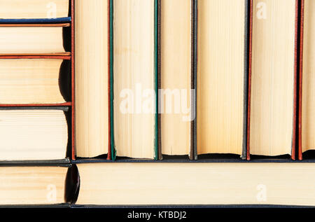 Abstract background of stacked on each other old books Stock Photo