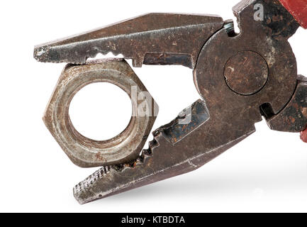 Closeup of old pliers and nut Stock Photo