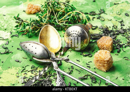 Dry tea leaf and fresh thyme for tea Stock Photo