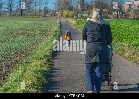 grandmother and grandchild go for a walk Stock Photo
