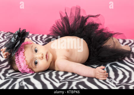 Four months old baby girl wearing a black tutu Stock Photo