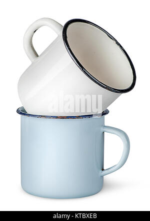 Two old enameled mugs on each other Stock Photo
