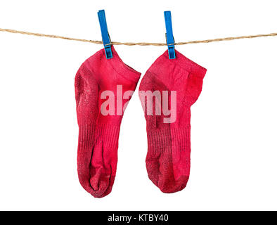 Pair of washed red socks on rope Stock Photo
