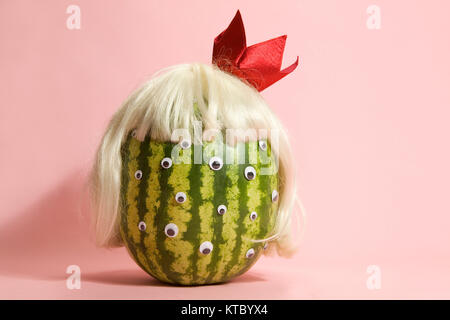 Freak watermelon wearing a wig Stock Photo