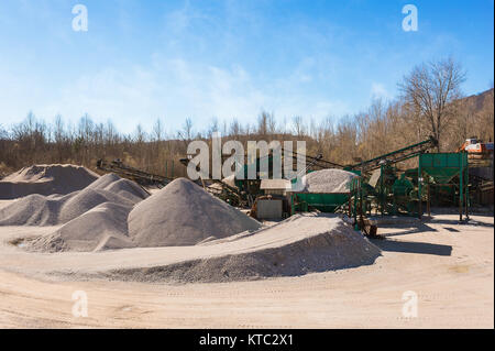 Gravel aggregate extraction. Machinery distribution and classification by size gravel. Stock Photo