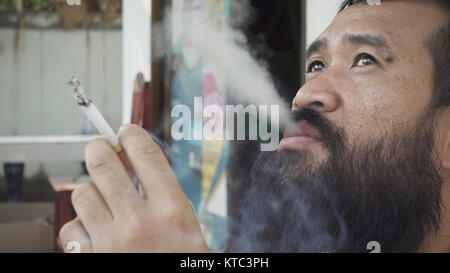 adult man smoking cigarette Stock Photo
