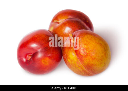 Three yellow and red plum near Stock Photo