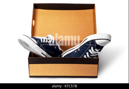 Dark blue sports shoes in cardboard box Stock Photo