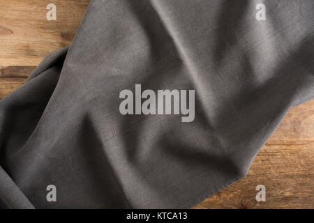 wooden table with dark tablecloth Stock Photo