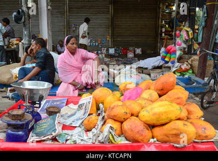 Delhi, India - Jul 26, 2015. People selling fresh fruits at the market in Delhi, India. Stock Photo