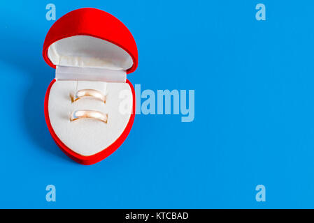 Gold wedding rings in a box of hearts Stock Photo