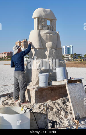 Sand sculpture being build by contestant in Sanding Ovation sand sculpture contest or festival on Treasure Island, beach, Florida, USA. Stock Photo