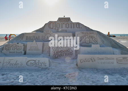 Giant sand sculpture with advertising for Corona beer, Sloppy Joe's, Bilmar Beach Resort and others on Treasure Island Florida, USA. Stock Photo